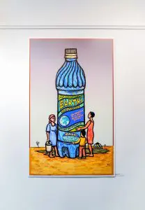 1 print of artwork by Ricardo Levins Morales on a white gallery wall.